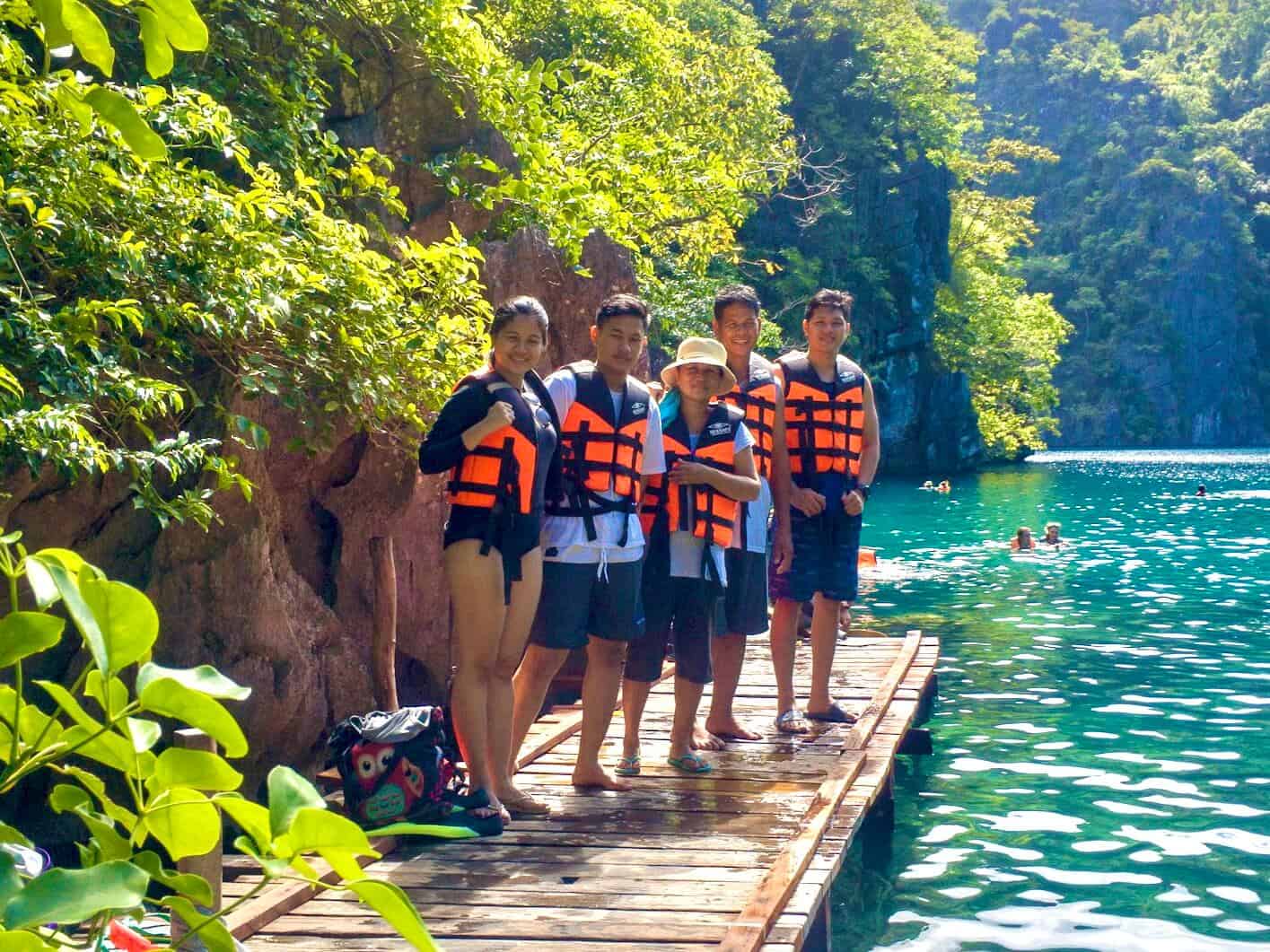 my family standing on Kyangan Lake in Coron