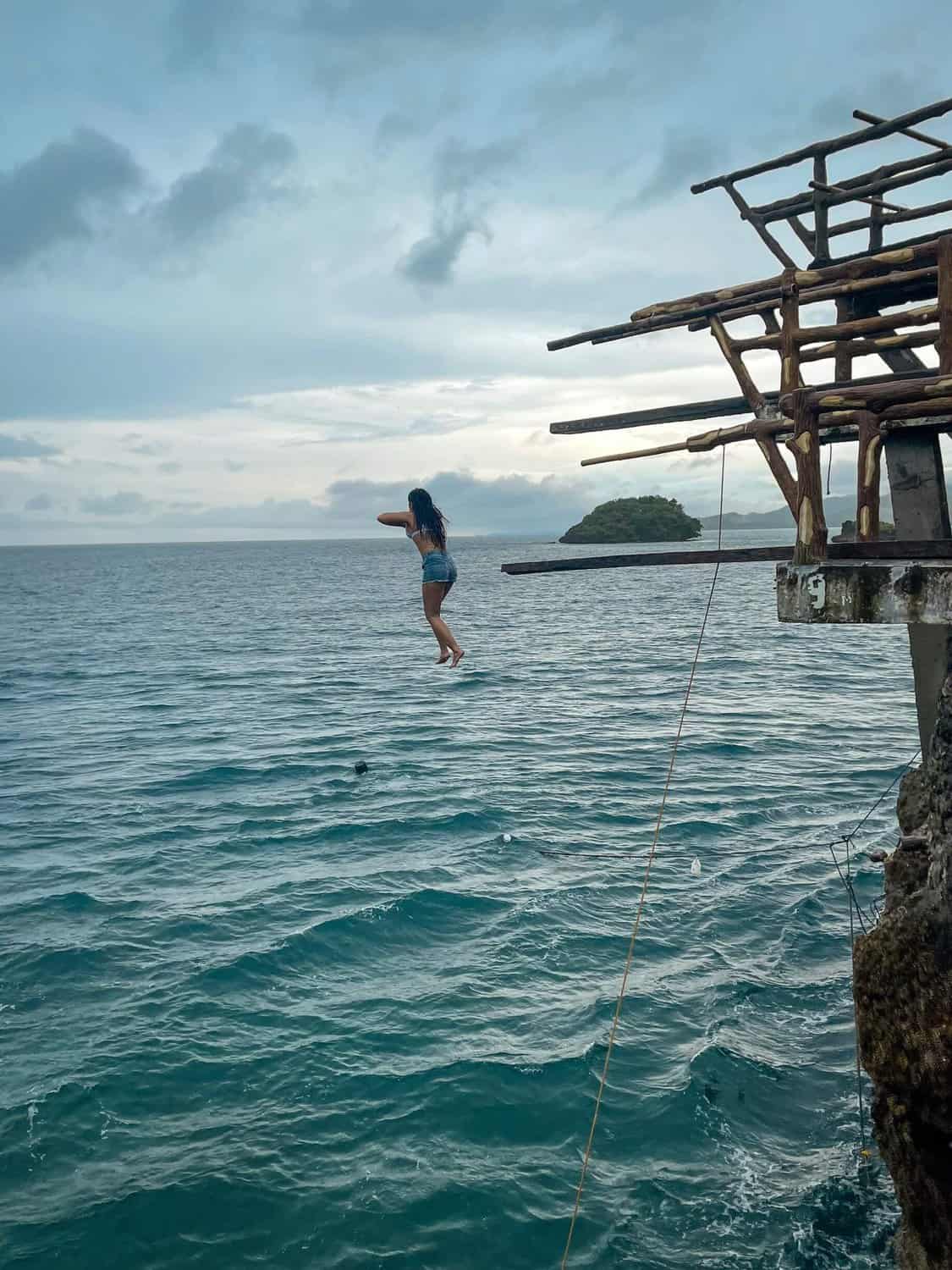 Me mid-air during a cliff dive into the sea in Boracay.