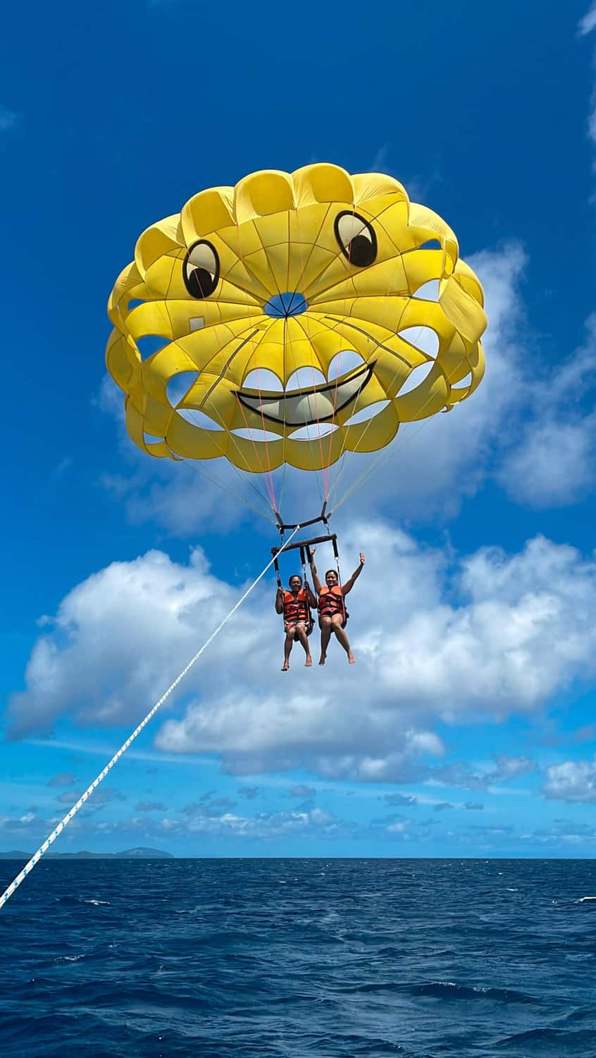 My mothe and I parasailing over the clear blue waters of Boracay.