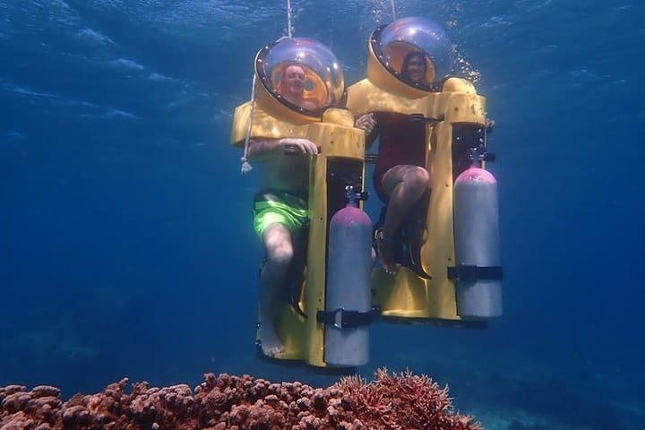 Two riders exploring underwater on a scooter in Boracay.