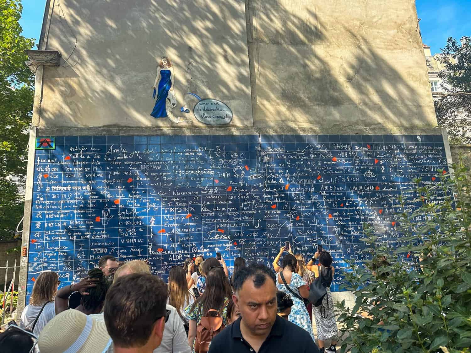 The Wall of Love in Paris in the Jehan Rictus garden square with 'I love you' in different languages.