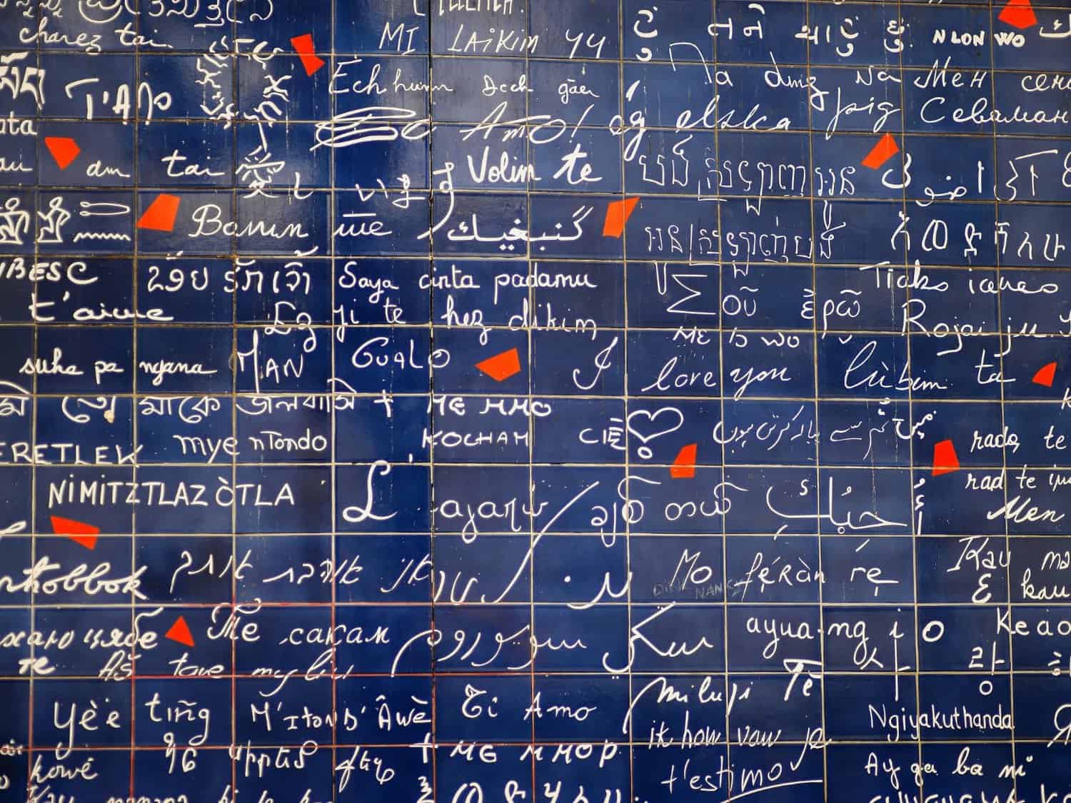 View of the Wall of Love in Paris showing various 'I love you' scripts.