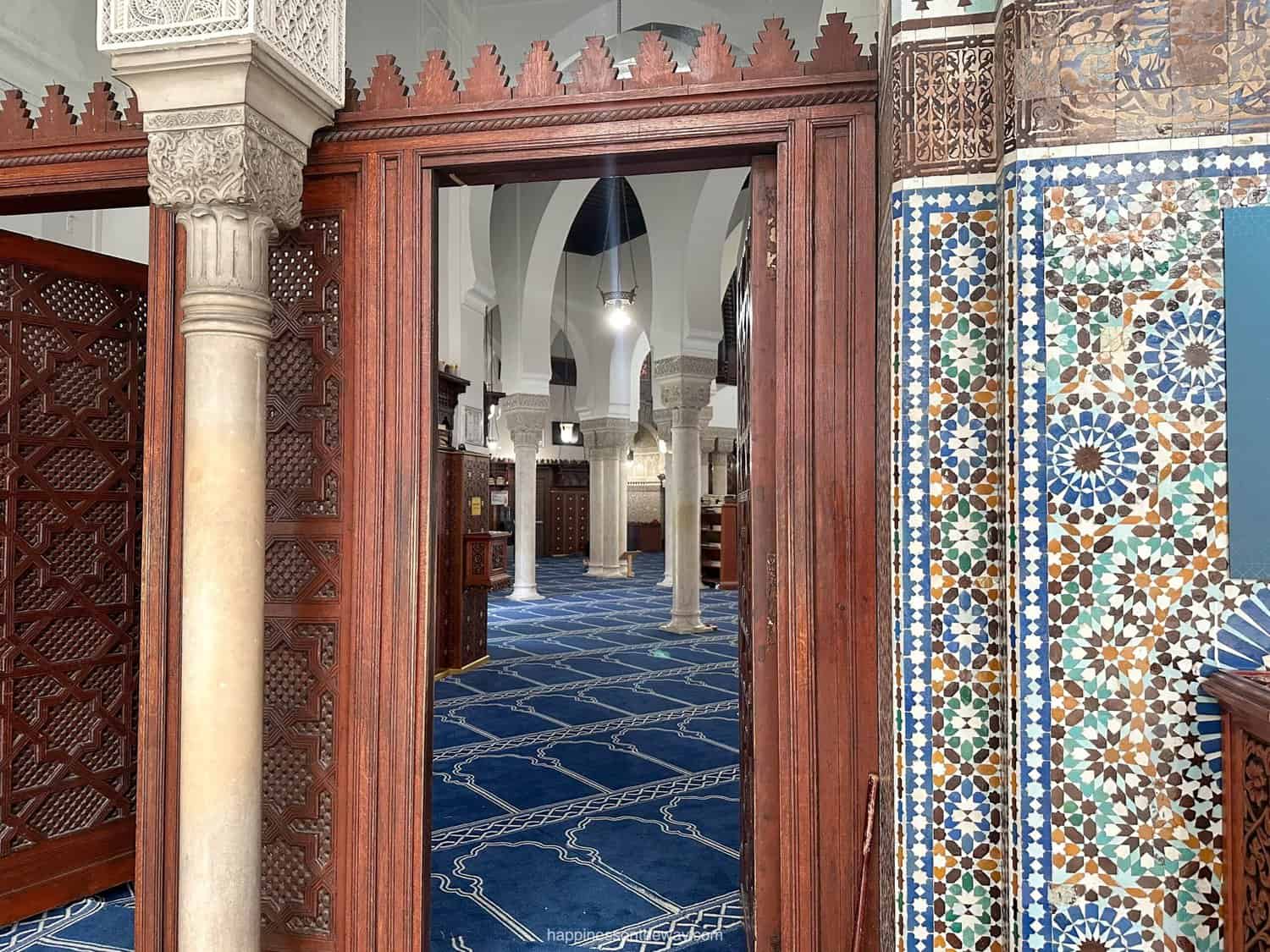 Interior of the Grand Mosque of Paris prayer room, highlighting its grand and serene ambiance.