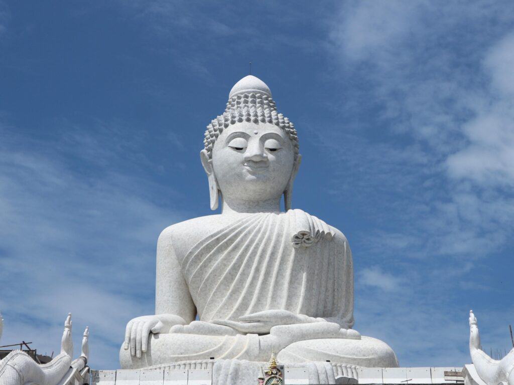 Wide-angle shot of the iconic Big Buddha Phuket against a backdrop of clear skies, highlighting its status as the third-largest Buddha statue in Thailand.