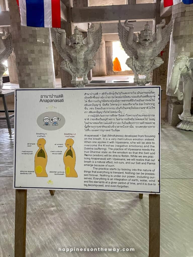 A guide on Anapansati, explaining sati (mindfulness) and how to do it through breating. The sign is inside the Big Buddha Phuket.
