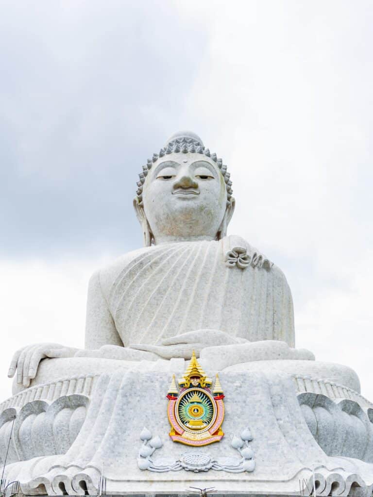 Close-up view of the serene face of Big Buddha in Phuket, emphasizing the detailed craftsmanship.