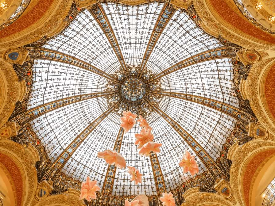 Stunning interior dome of Galeries Lafayette, a historic department store in Paris.