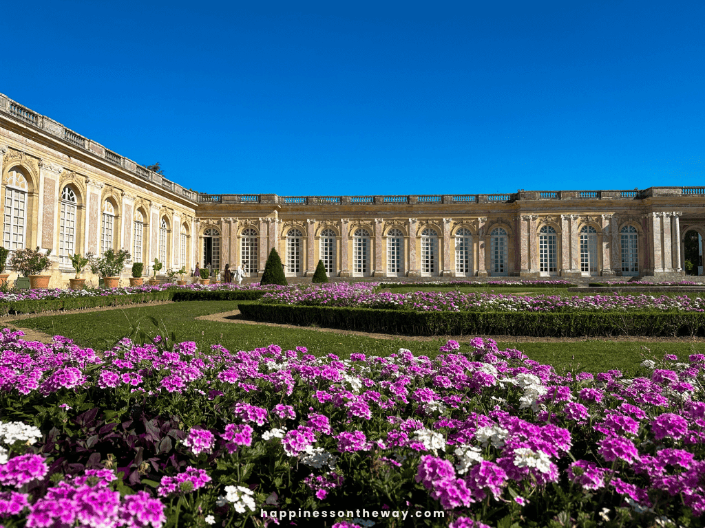 Elegant architecture and manicured gardens at the Grand Trianon in Versailles.