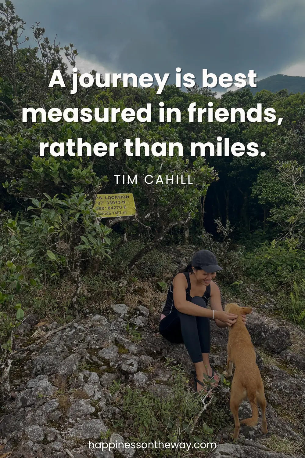 Me sitting and bonding with a dog on a rocky trail surrounded by dense greenery, with the quote 'A journey is best measured in friends, rather than miles.' by Tim Cahill