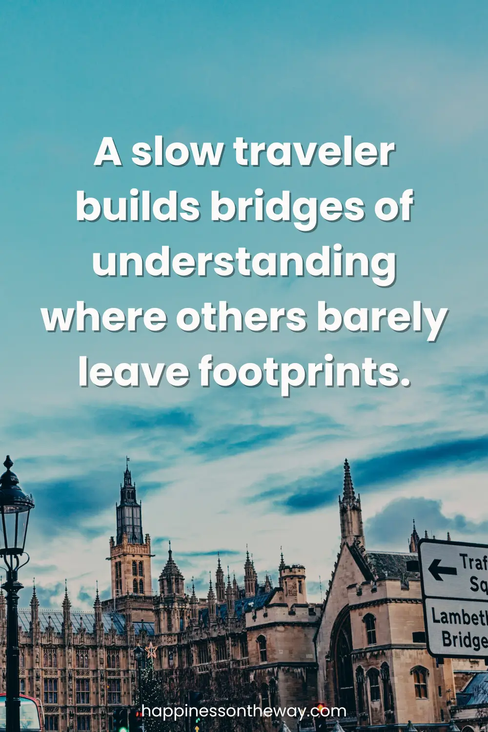 Buildings in London on a blue sky with a low travel quote: A slow traveler builds bridges of understanding where others barely leave footprints.