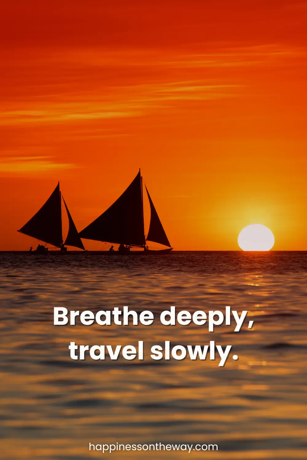 Paraw sailboats during sunset on the calm waters of Boracay with slow travel quote: Breathe deeply, travel slowly.