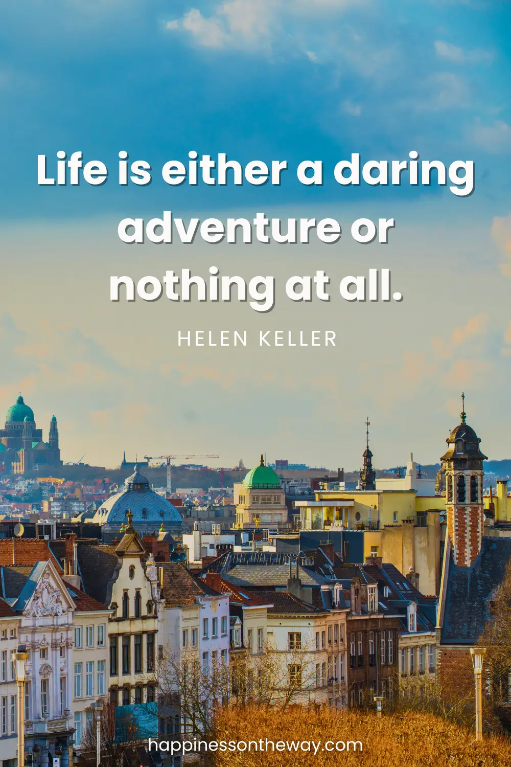 A panoramic view of the old buildings in Belgium with a quote: Life is either a daring adventure or nothing at all by Helen Keller.