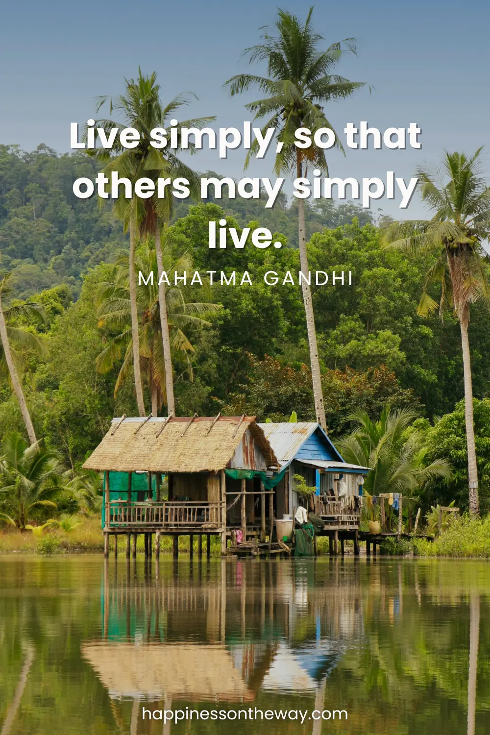 A simple bamboo hut house in Cambodia over a river and with coconut trees as a background with an inspiring quote Live simply, so that others may simply live.” by Mahatma Gandhi