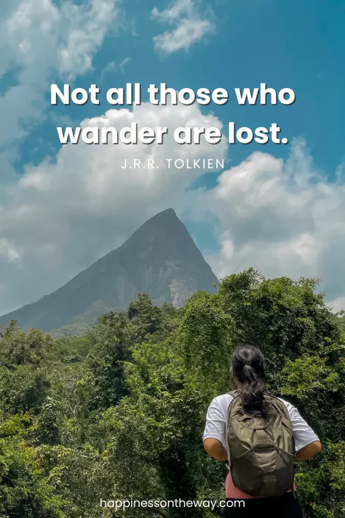 Me with a backpack facing a majestic mountain peak amidst a lush forest, with the J.R.R. Tolkien quote 'Not all those who wander are lost.'