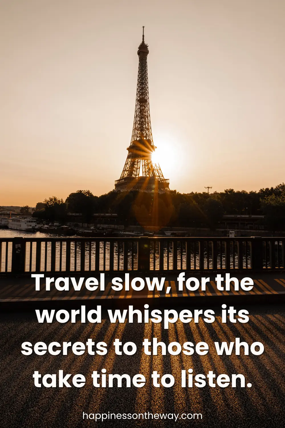 Sunrise behind the Eiffel Tower in Paris, seen through the silhouette of a bridge railing, with the inspiring slow travel quote 'Travel slow, for the world whispers its secrets to those who take time to listen.'