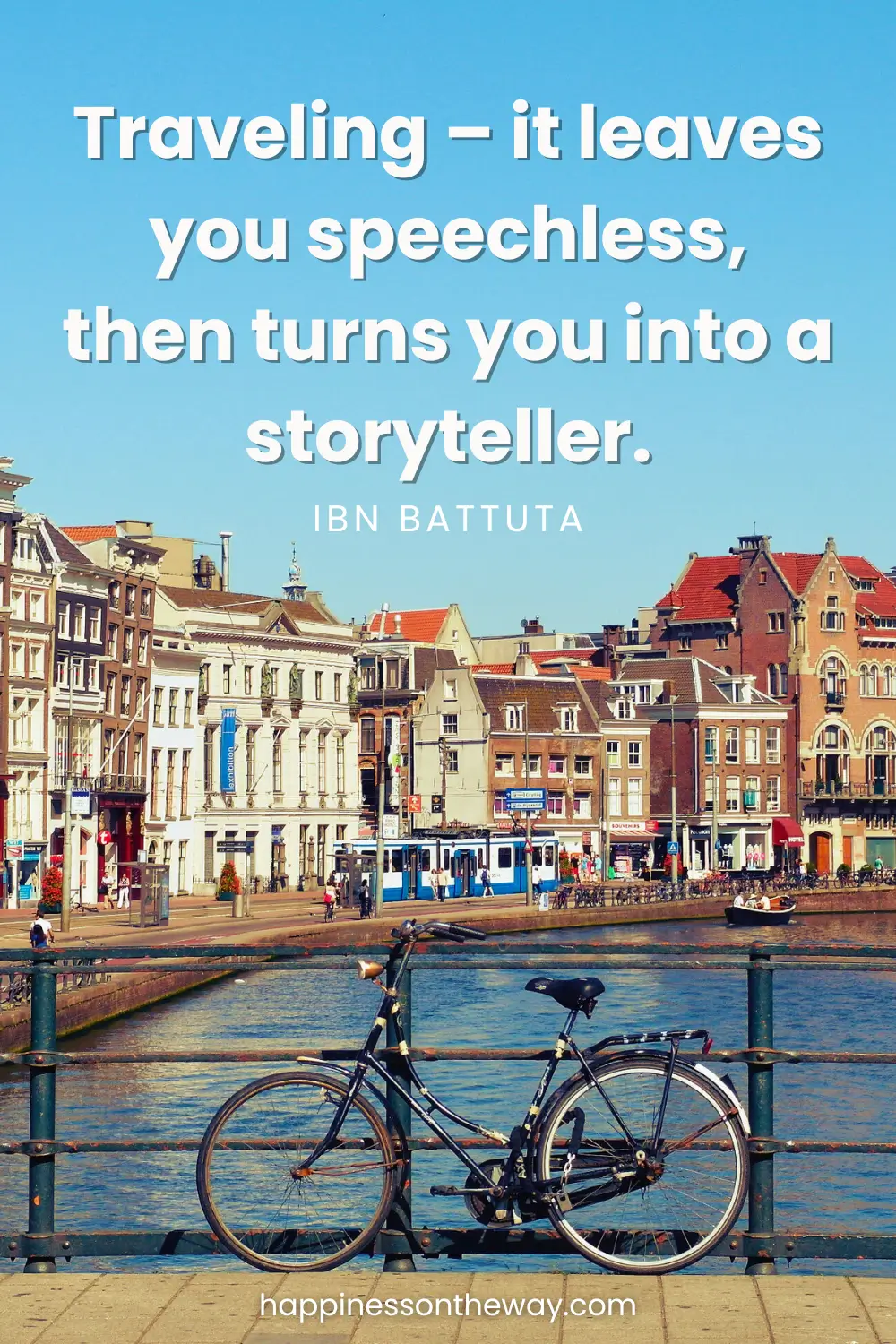 A bicycle on a bridge in Amsterdam overlooking old and colorful houses on a canal with a slow travel quote: Traveling – it leaves you speechless, then turns you into a storyteller by Ibn Battuta