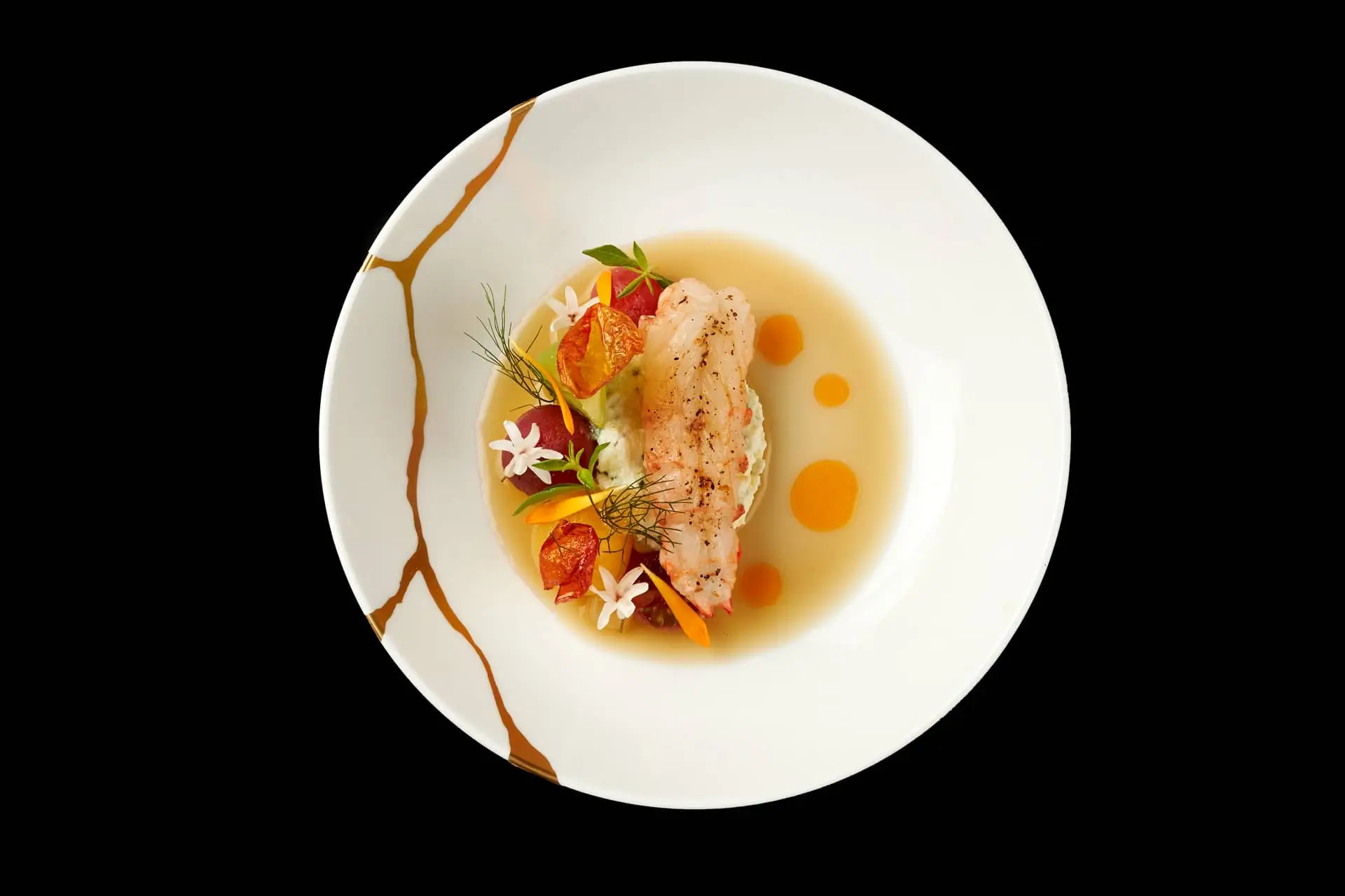 Exquisite plating of a seafood dish at Mallory Gabsi's restaurant, capturing the affordable sophistication of Michelin-star dining in Paris, with a succulent fish filet, colorful garnishes, and artistic sauce on a white plate against a stark black background.