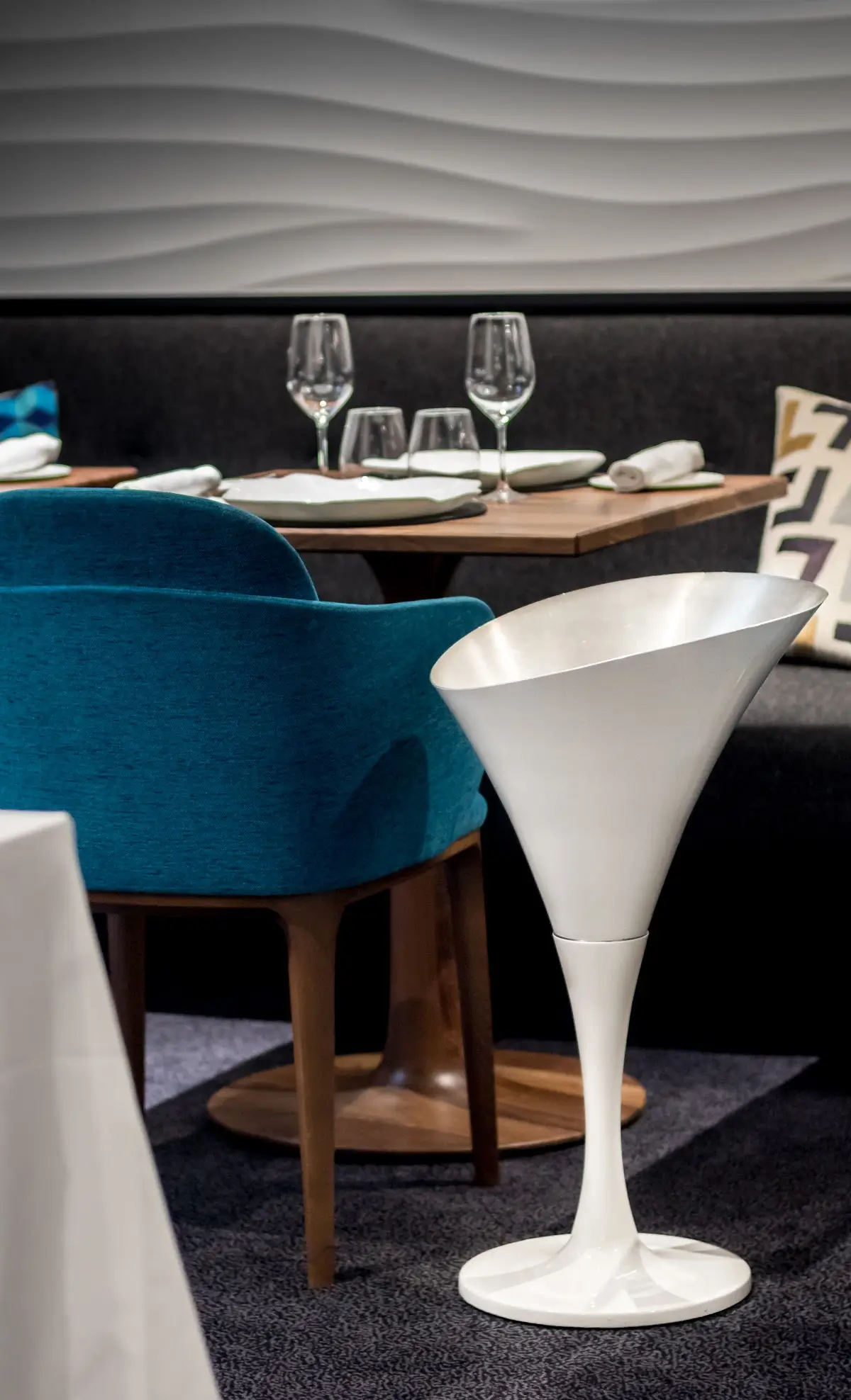 Table setting with blue chairs at Auguste, a Michelin Star restaurant in Paris.