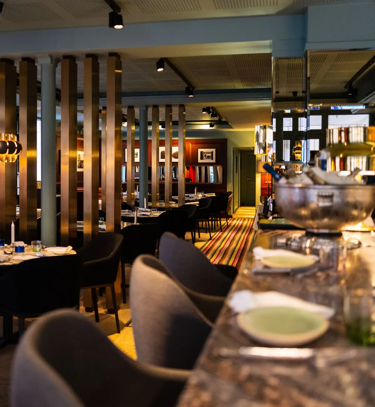 Modern interior of Restaurant Gaya in Paris, featuring stylish decor and seating.