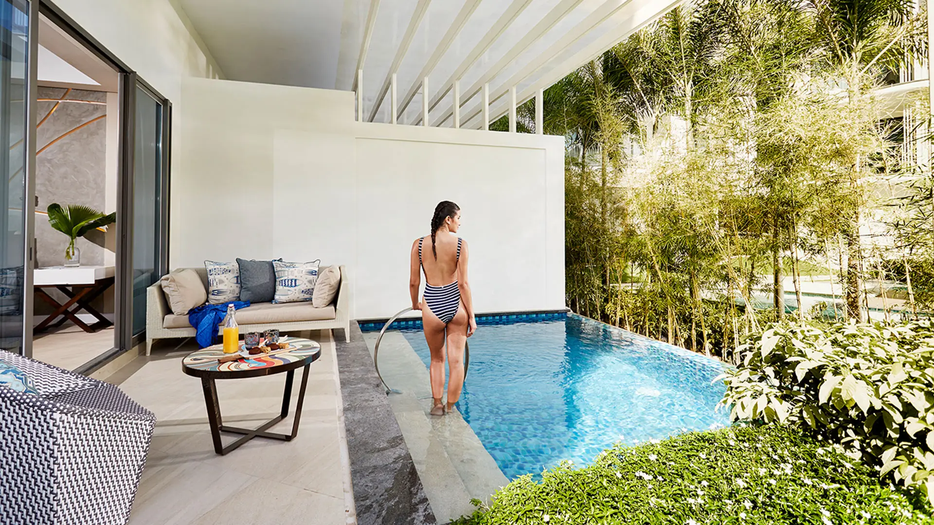 Cozy poolside lounge area at The Lind Boracay, a Boracay boutique resort, featuring modern furniture, a refreshing pool, and lush greenery, creating a tranquil escape.