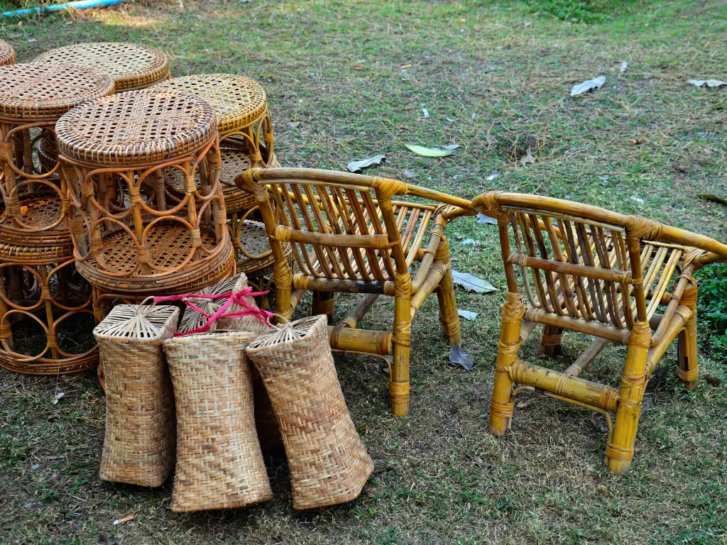 Baskets, center stands ad chairs made of bamboo displayed on the grass