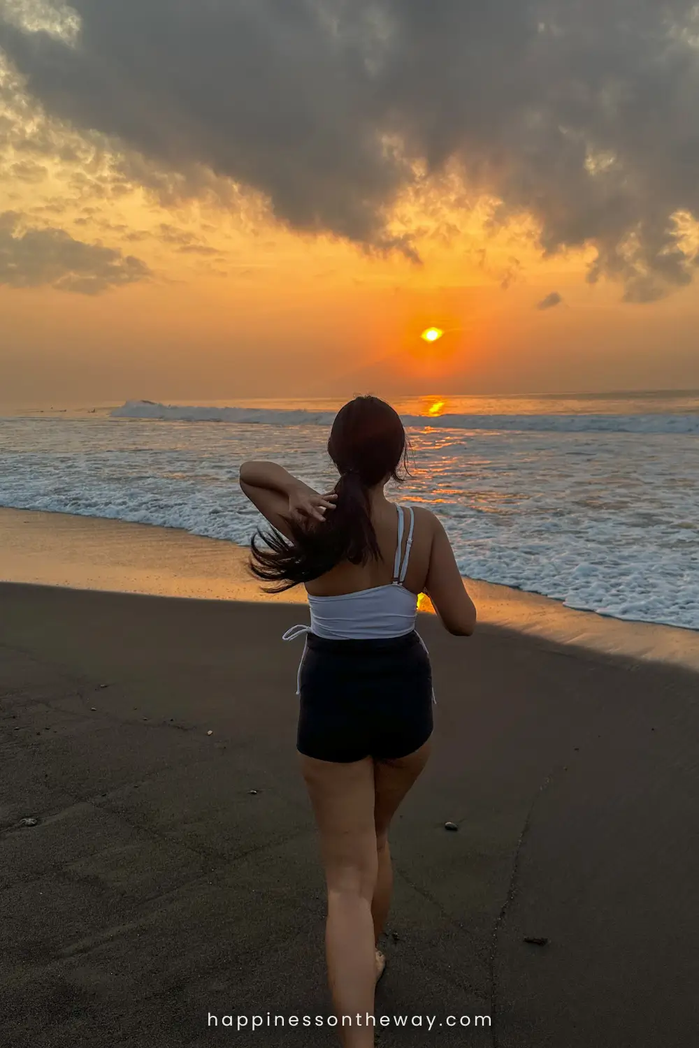 Me walking on a black sand beach, Keramas Beach, nearby Ubud