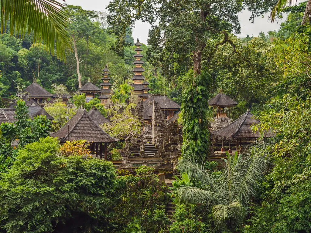 Roofs of temples in a forest-like garden of Pura Gunung Lebah