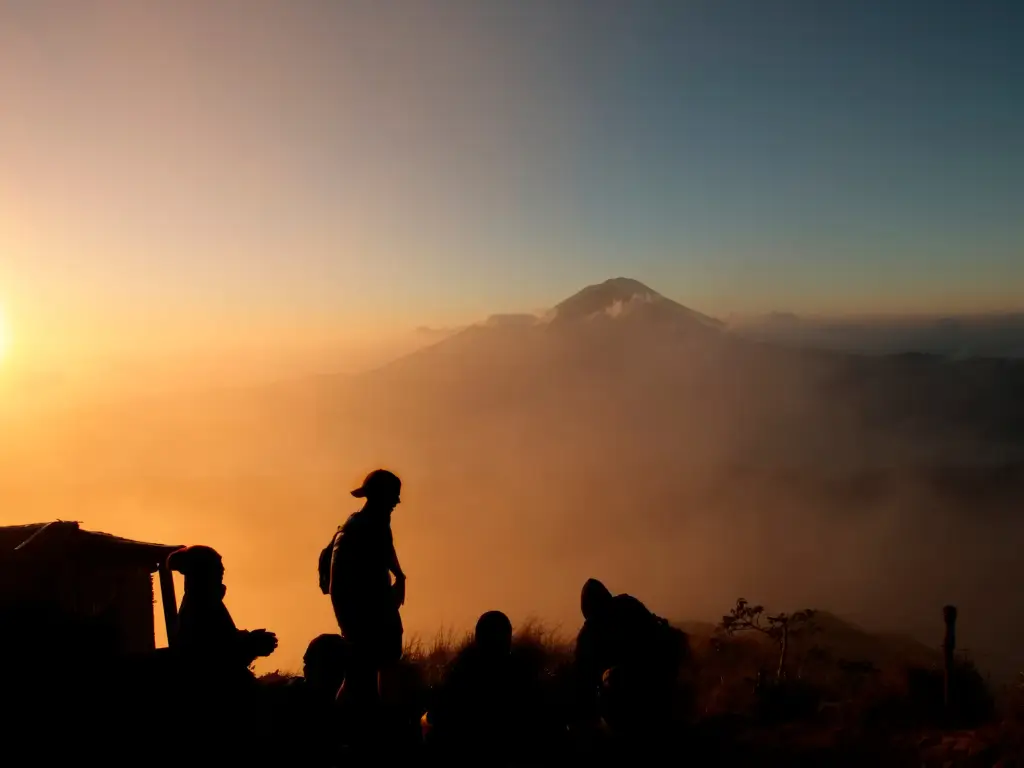 Trekkers' silhouette during a sunrise in Mt Batur