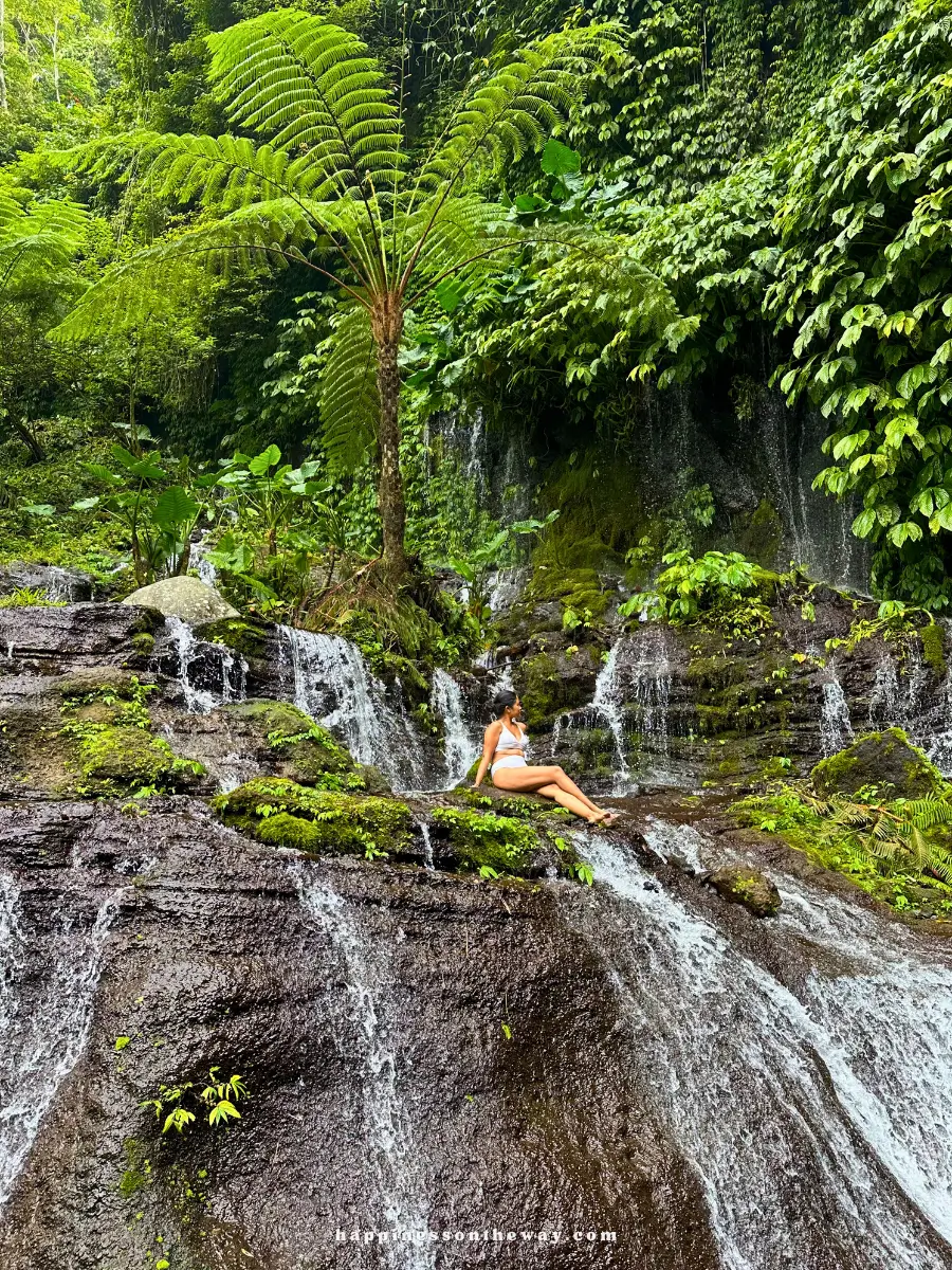 Me sitting at the terraced rocks beside Banyumala Twin Waterfalls