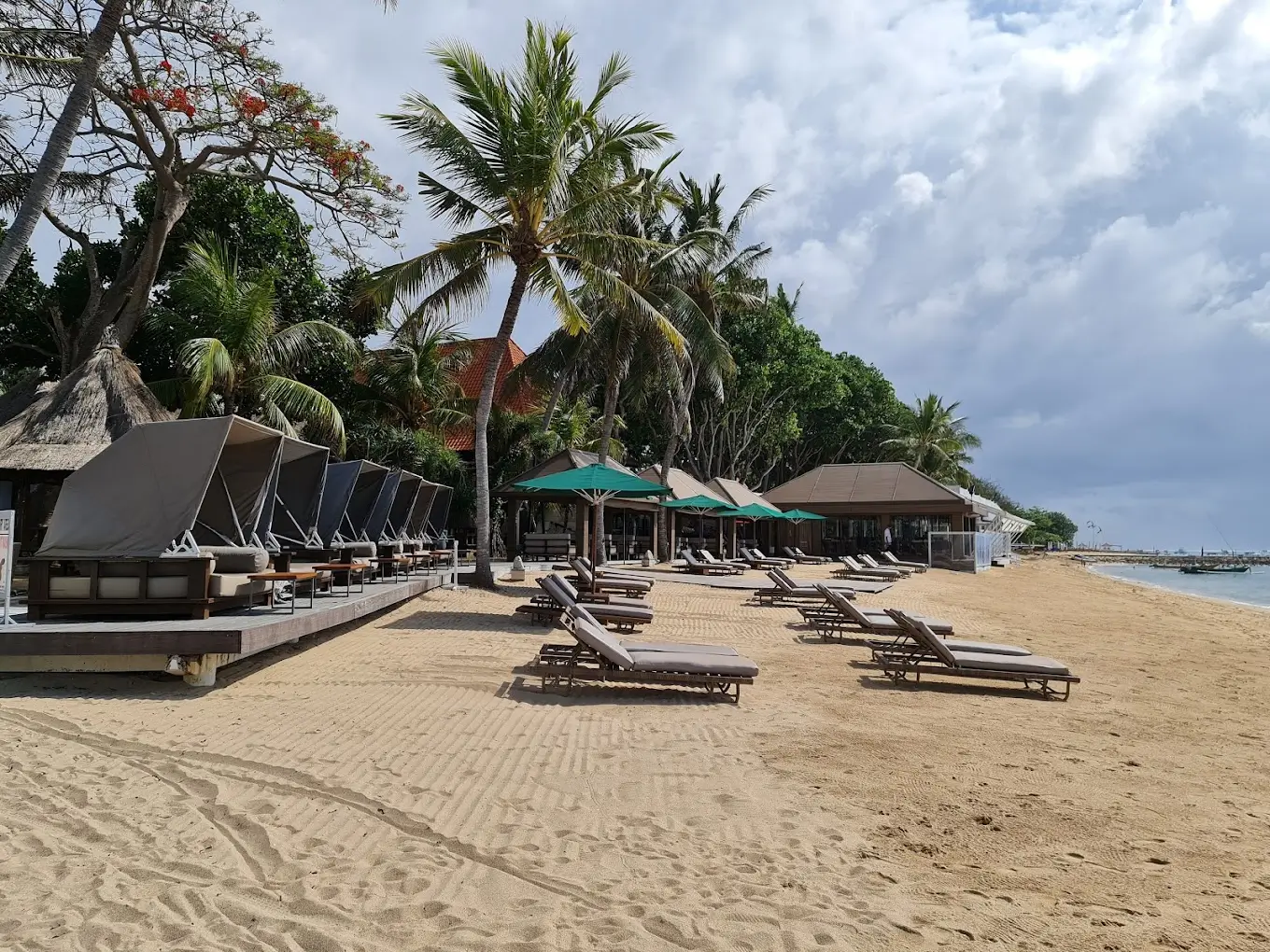 Cavanas and sun umbreallas in Cemara Beach in Sanur