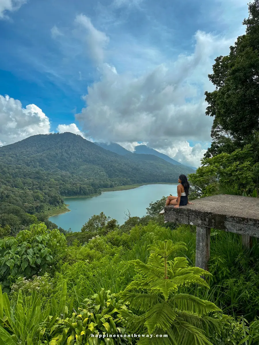 Me sitting on a platform looking at the twin lakes in Munduk Bali, one of my favorite day trips from Ubud