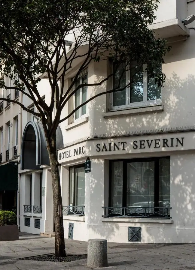 The elegant cream facade of Hotel Parc Saint Severin