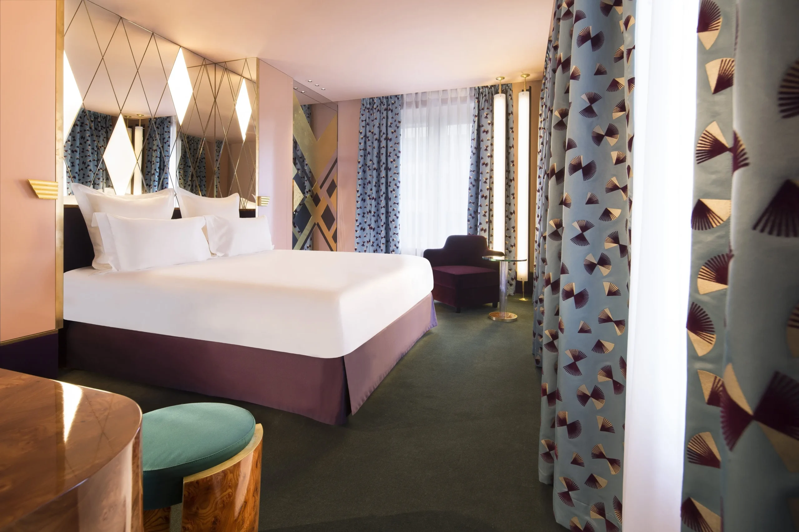 A tranquil room at Hotel Saint-Marc in Paris, featuring crisp white linens on a cozy bed.