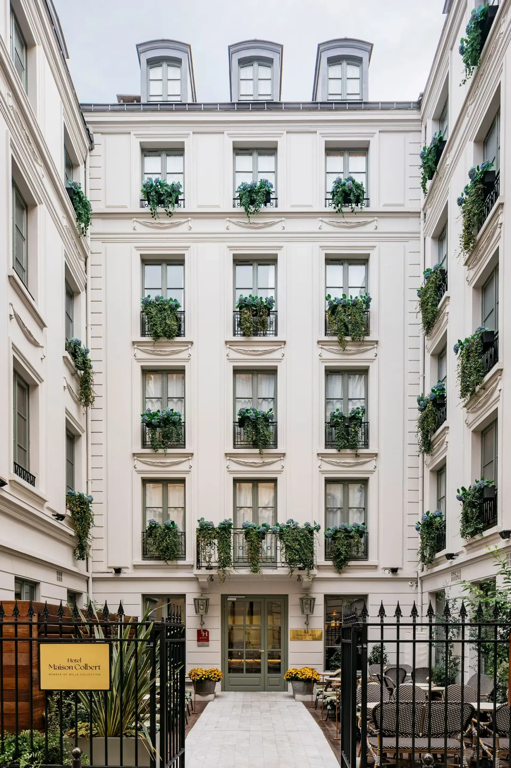 Charming entrance of Maison Colbert Meliá Collection, a luxury quiet hotel in Paris.