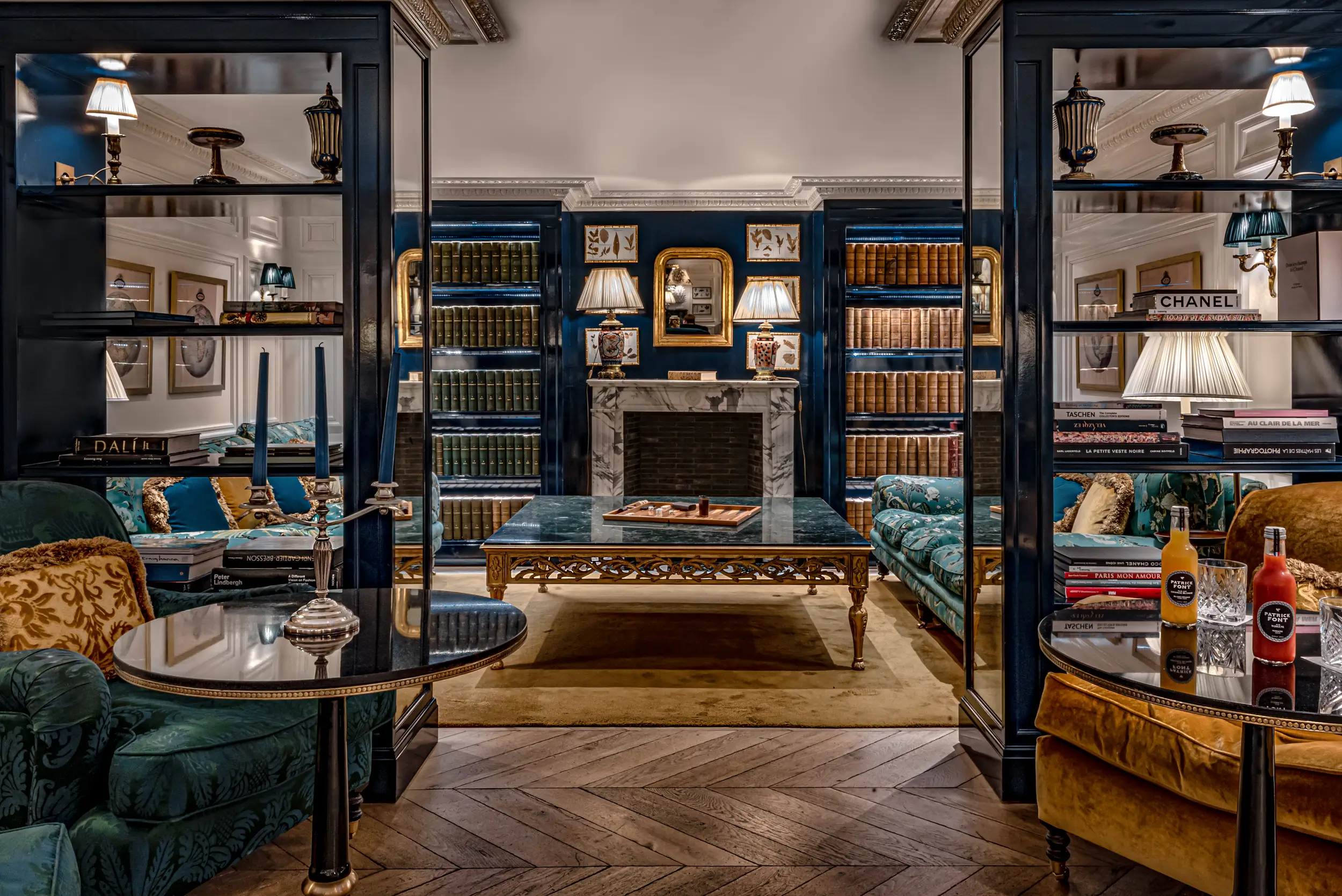 Cozy living room at Relais Christine, a quiet hostel in Paris with a classic library ambiance.