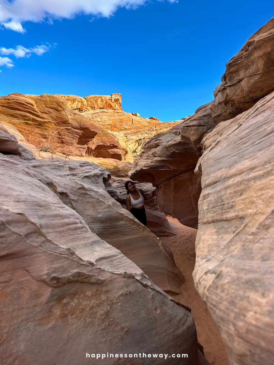 The Seven Wonders Trail in Valley of Fire State Park, featuring rugged, red sandstone cliffs and a winding path.