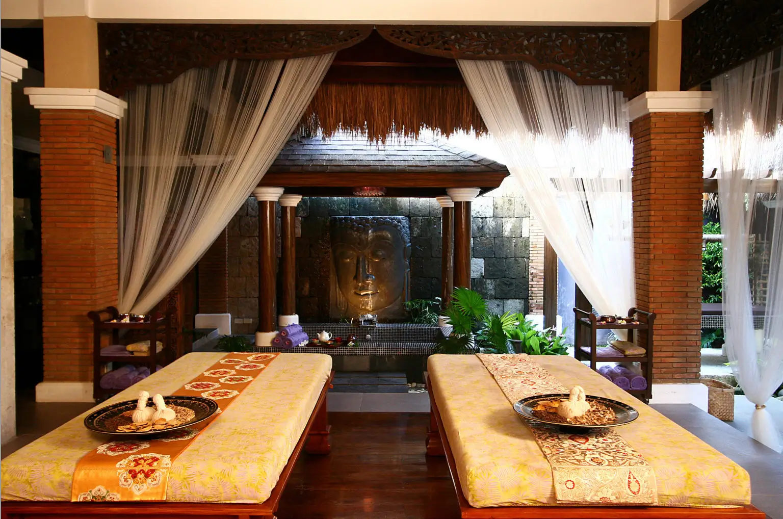 Tirta Spa in Boracay, an upscale retreat showcasing luxurious massage tables and an ornate, tranquil interior. A