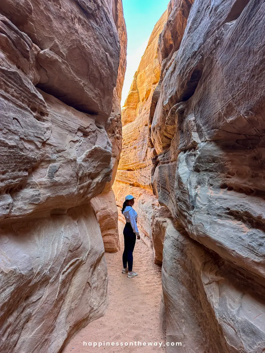 A narrow slot canyon with smooth, towering sandstone walls in Valley of Fire State Park.