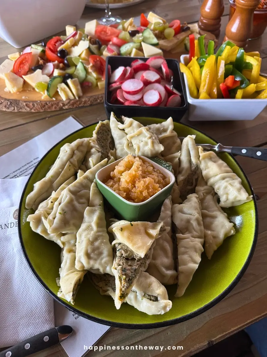 A plat of hand-rolled maultaschen and onion on the middle