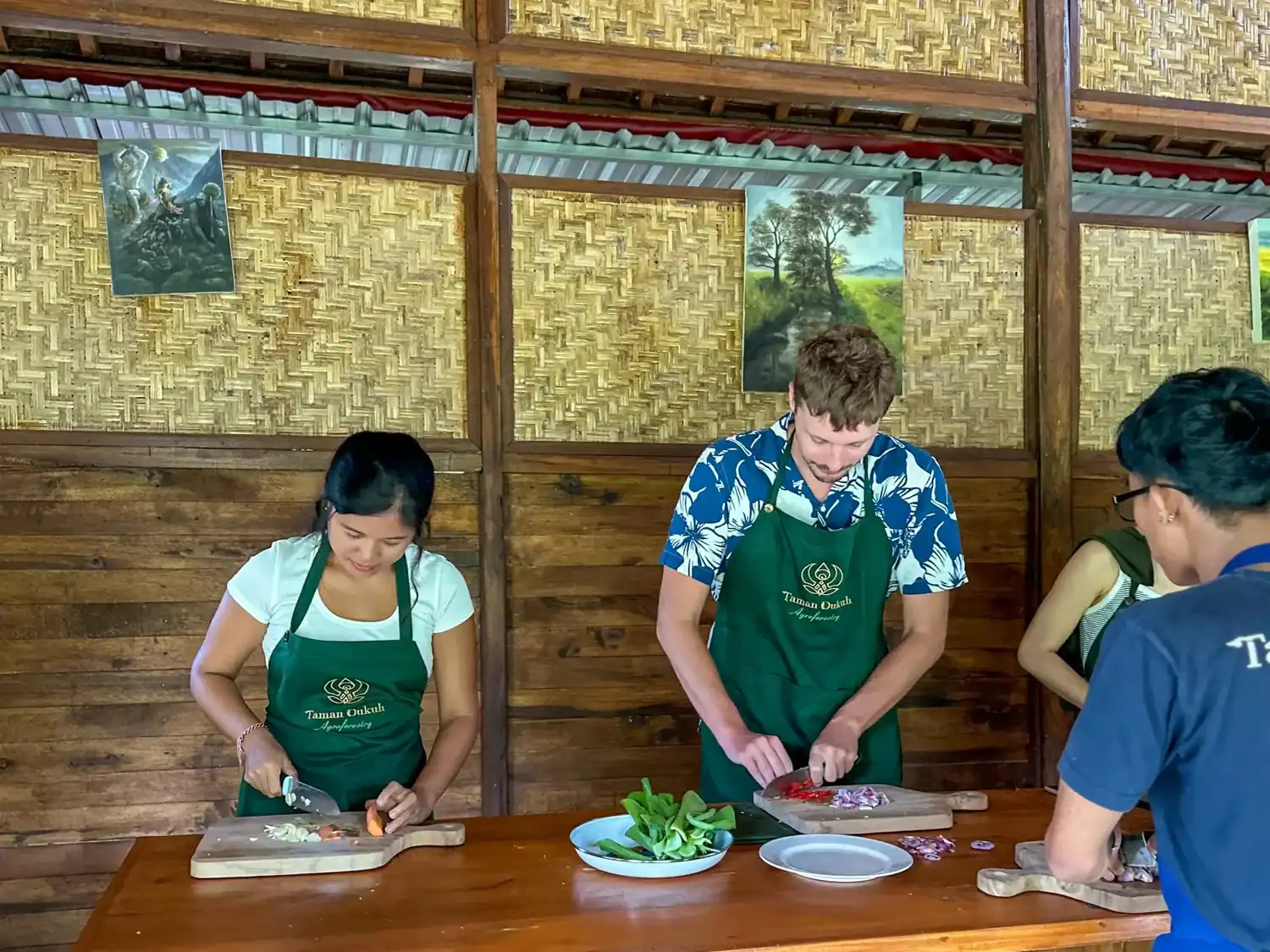 Learning to cook traditional dishes during a local class with fellow travelers.