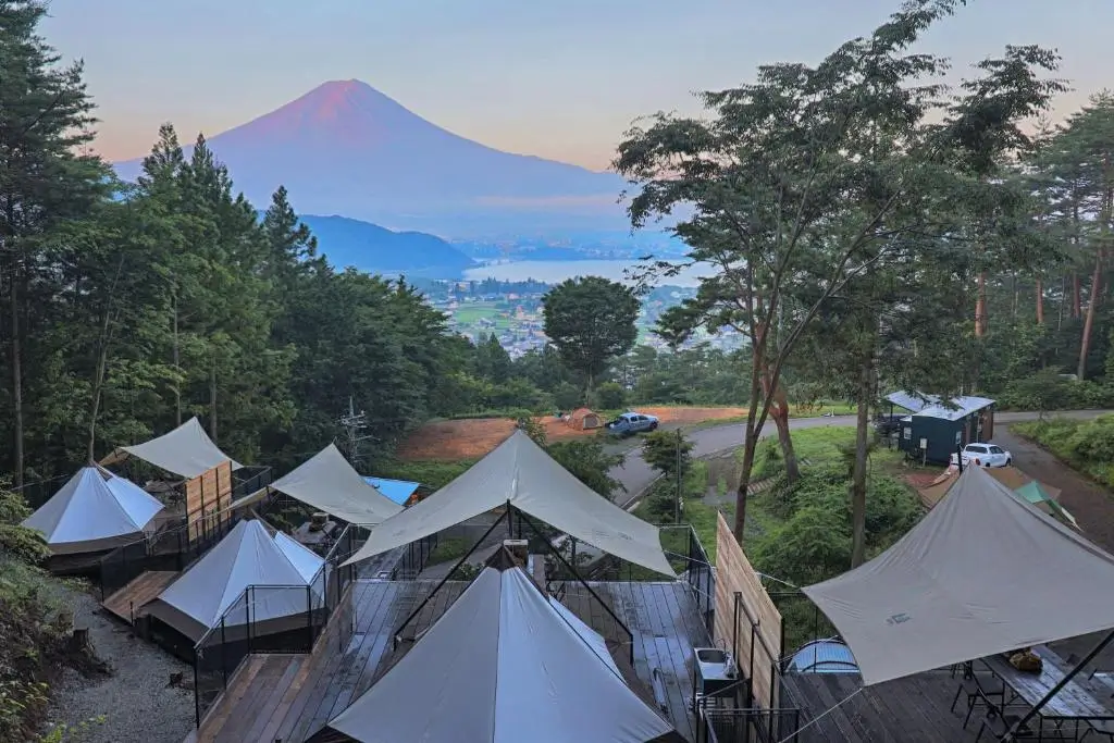 Glamping tents at Retreat Camp Mahoroba with Mount Fuji and Lake Kawaguchi view at sunrise