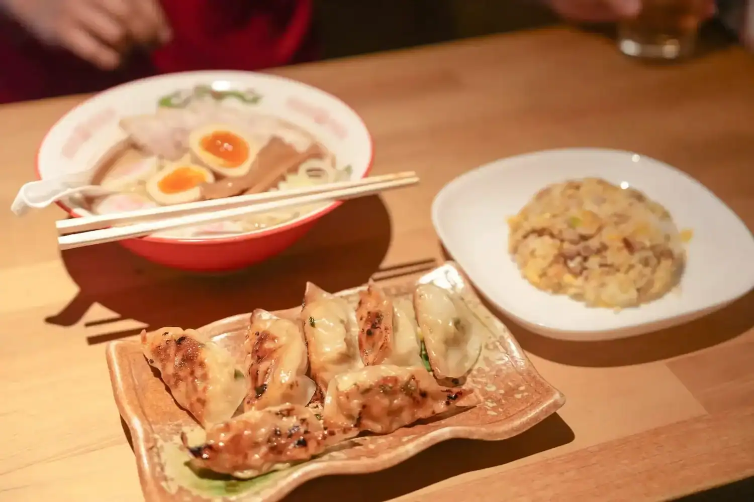 Pan-fried gyoza, a bowl of ramen with soft-boiled eggs. 