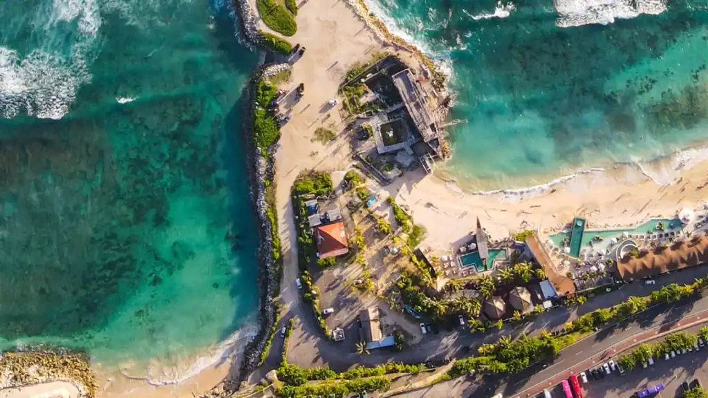 Aerial view of Karma Beach at Karma Kandara Resort with turquoise water and beach club area.