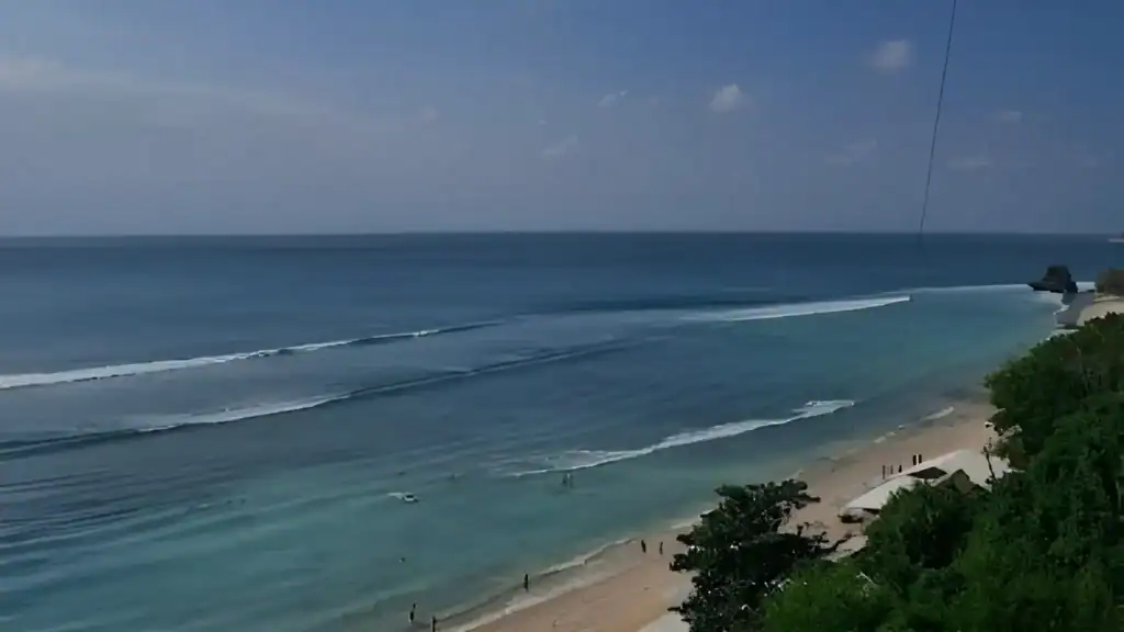 Thomas Beach Uluwatu with soft white sand and calm turquoise water.