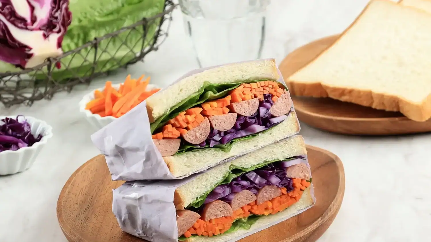 Japanese convenience store sandwich filled with sausage, carrots, and cabbage—an example of the fresh, neatly layered konbini foods in Japan.
