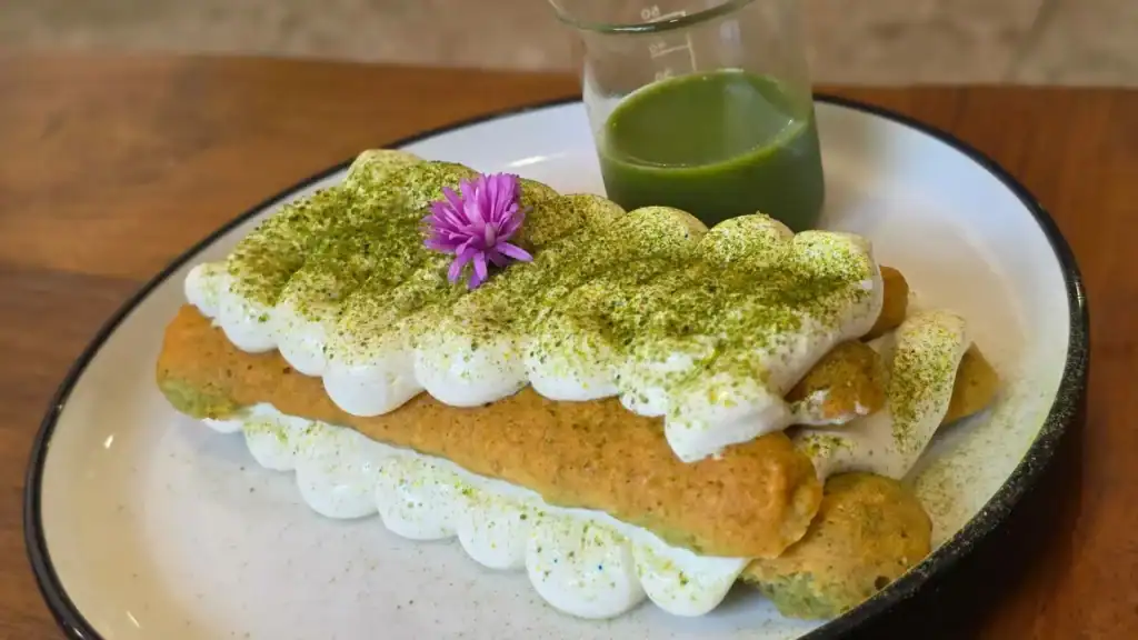 Matcha tiramisu-style dessert dusted with green tea powder, showcasing one of Japan’s most popular matcha sweets