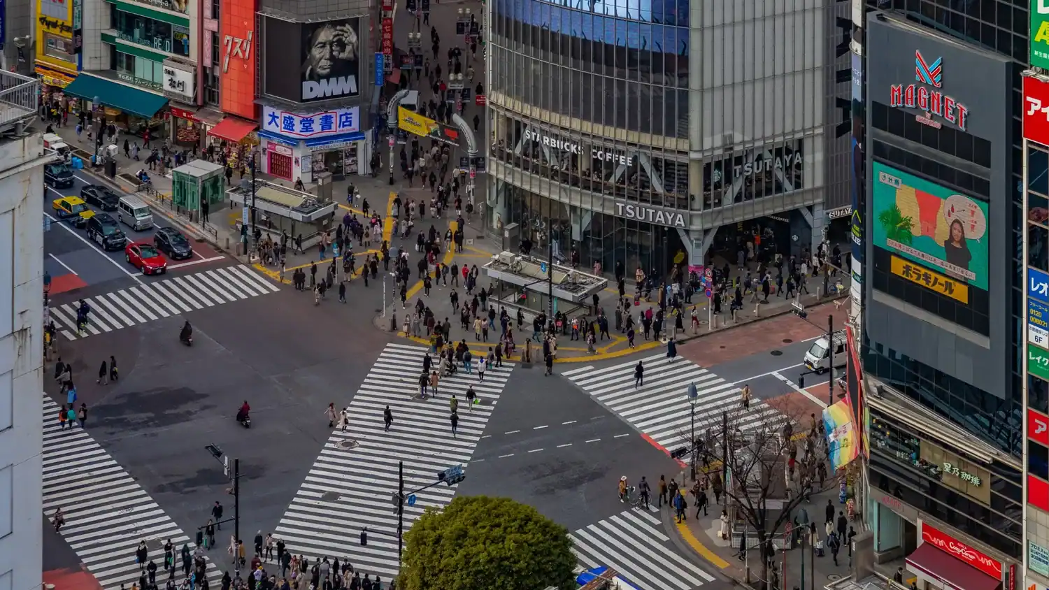 Shibuya Crossing aerial view with crowds crossing, iconic things to do in Tokyo