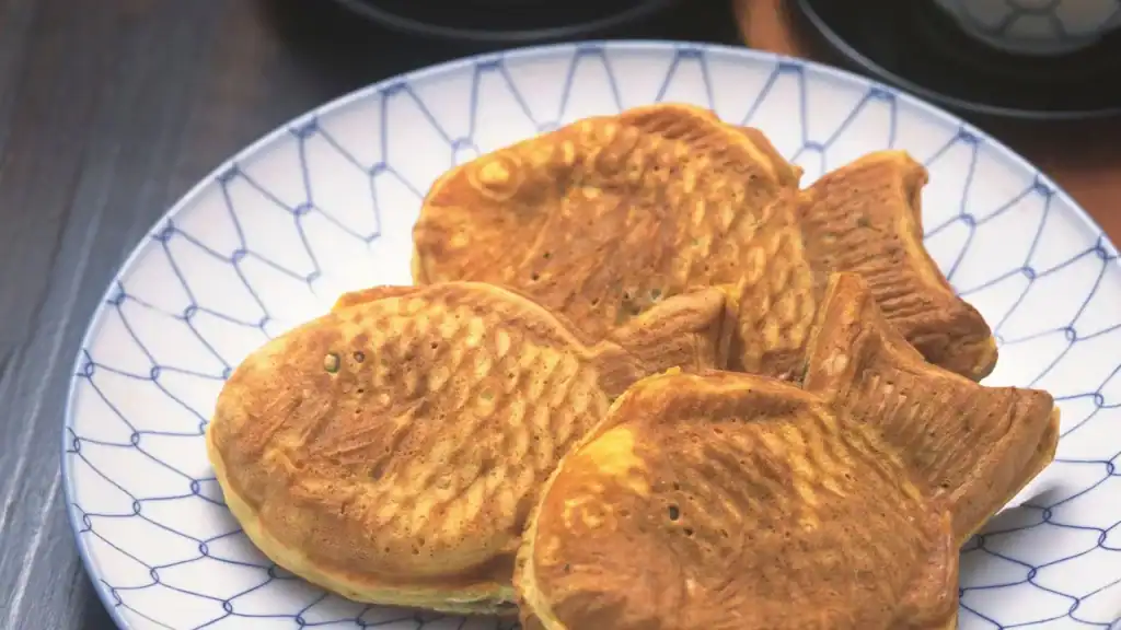 Freshly baked taiyaki, a popular Japanese dessert shaped like a fish, filled with sweet red bean paste.