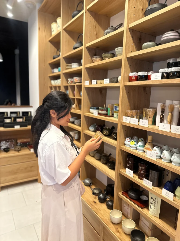 Things to Do in Uji: browsing traditional tea bowls and matcha tools inside a local Uji tea shop