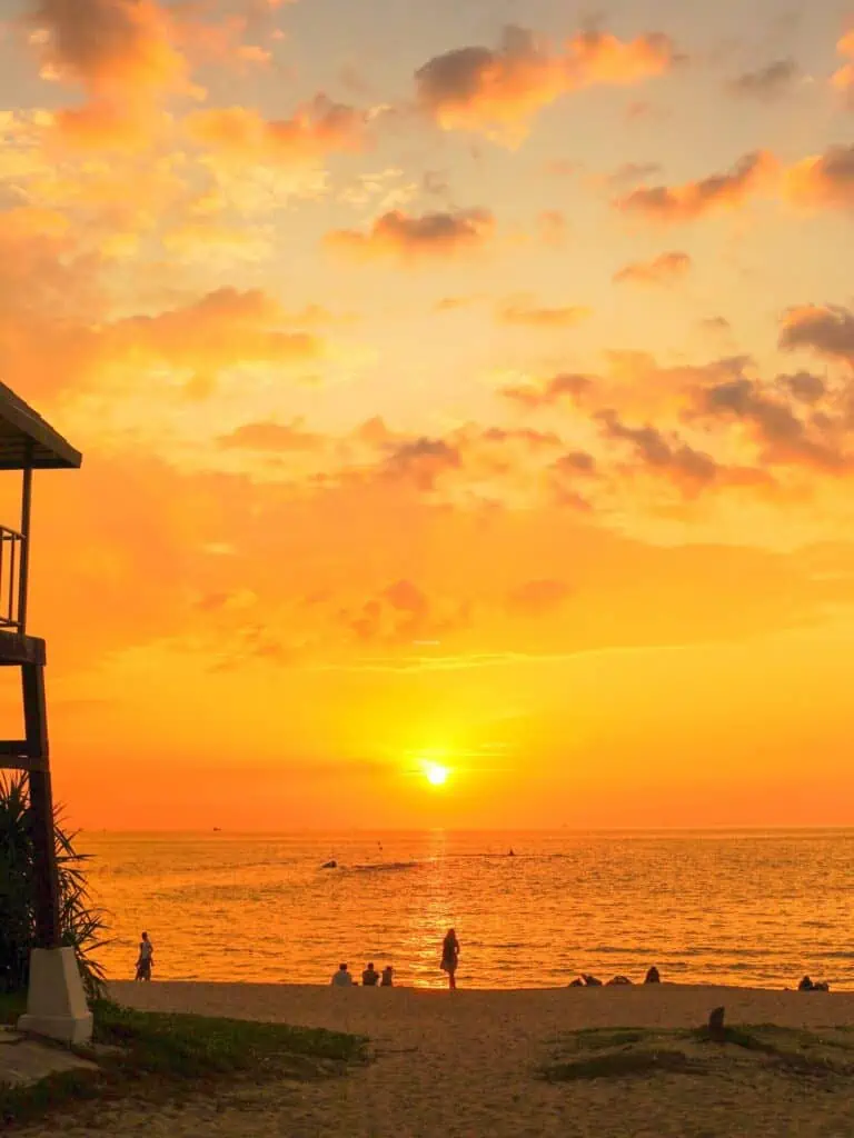 A sunset in a beach in Phuket, where some yogi do their exercises.